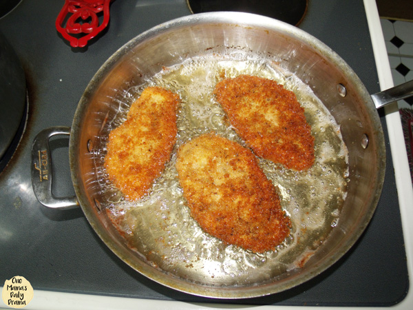 Breaded chicken frying for chicken parmesan