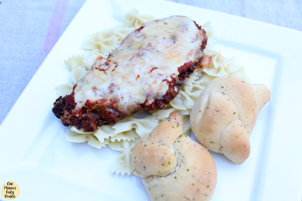 chicken parmesan with pasta and bread