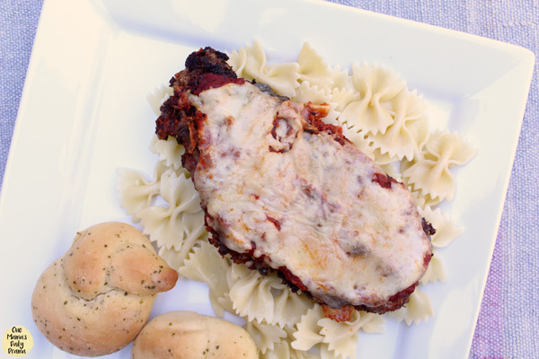 chicken parmesan with pasta and bread