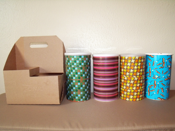 Drink carrier beside four different oatmeal containers