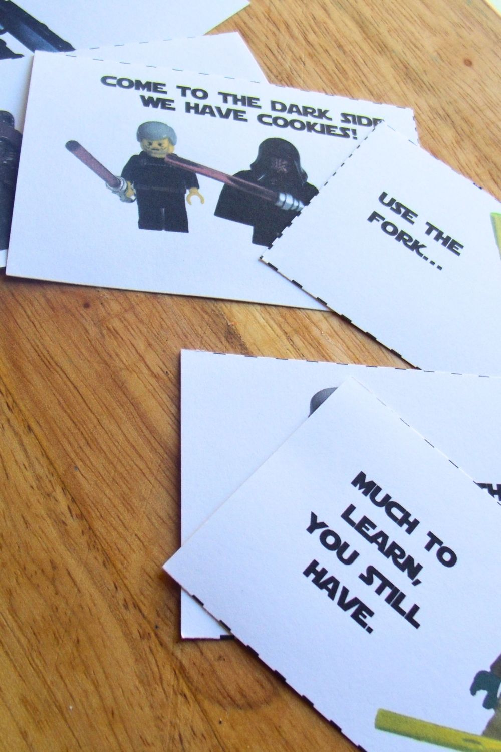 Paper LEGO Star Wars lunchbox notes with punny quotes from characters, including "use the fork."