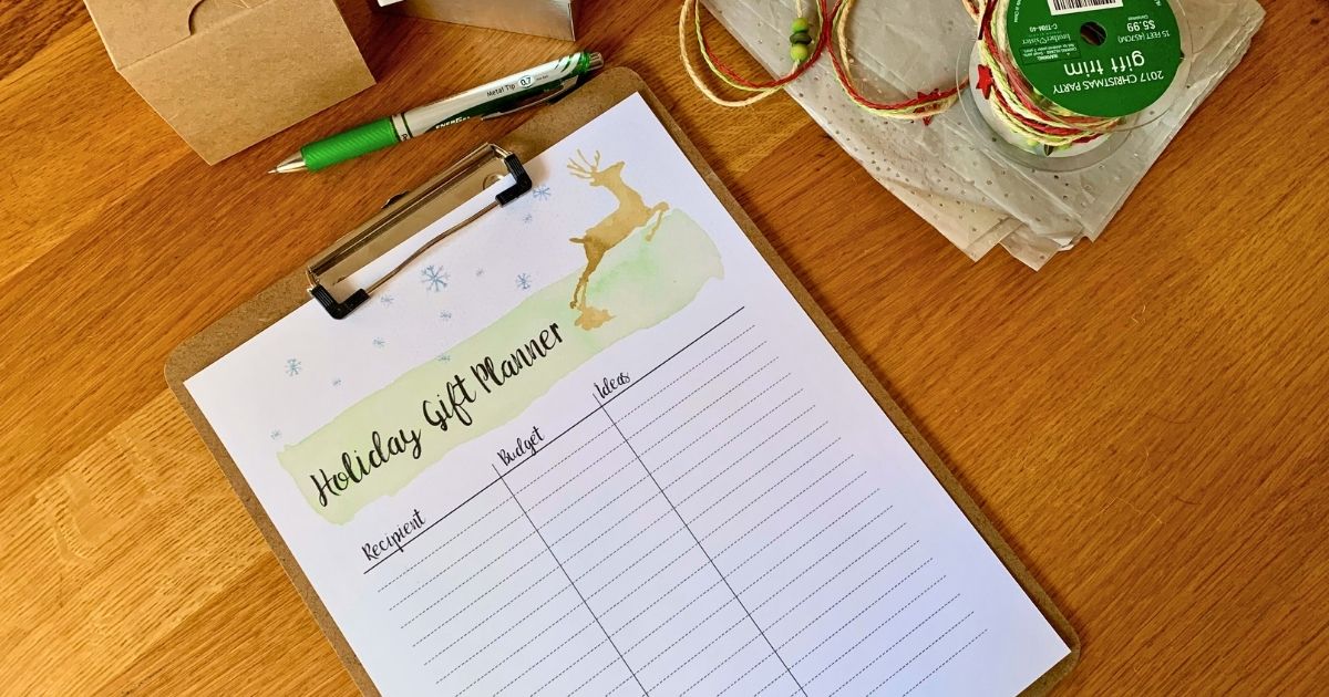 Holiday gift planner with watercolor reindeer clipart and a grid for tracking the recipient, budget, and gift ideas.