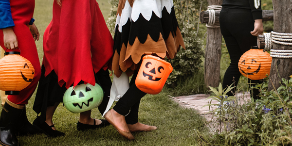 kids in costumes going to trick-or-treat on Halloween