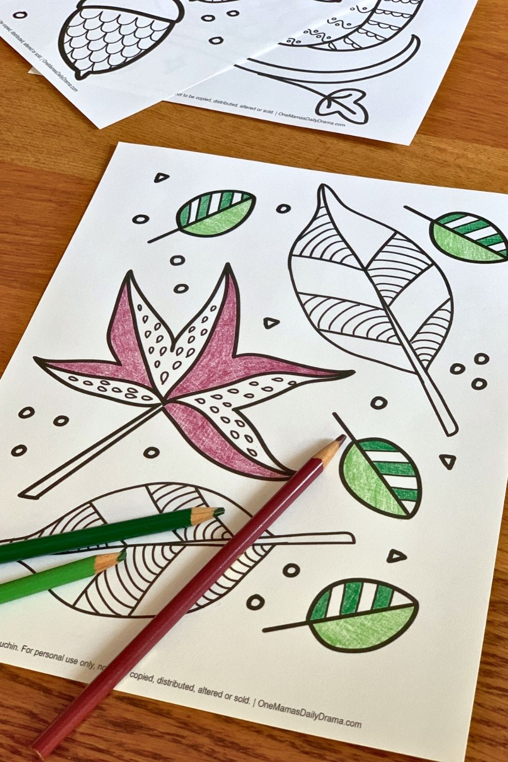 Picture of leaves partially colored in purple and green pencil.