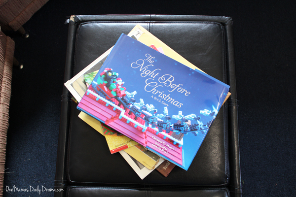 The Night Before Christmas: A Brick Story on the top of a stack of holiday books.