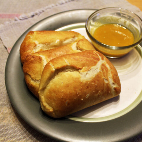 Pretzel pocket sandwich recipe | One Mama's Daily Drama --- Make your own ham and swiss hot pockets with a pretzel crust.
