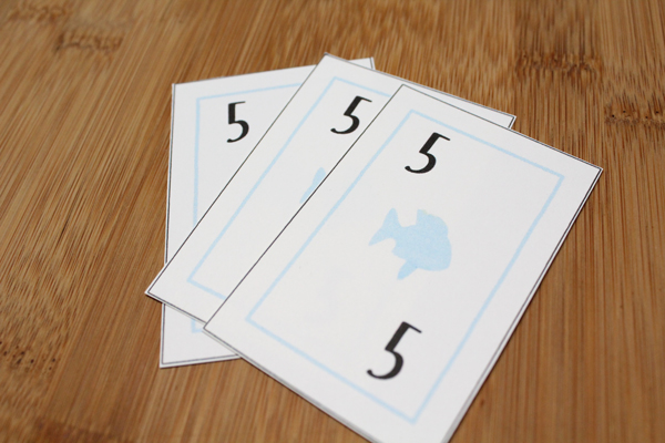 3 go fish cards with the number 5