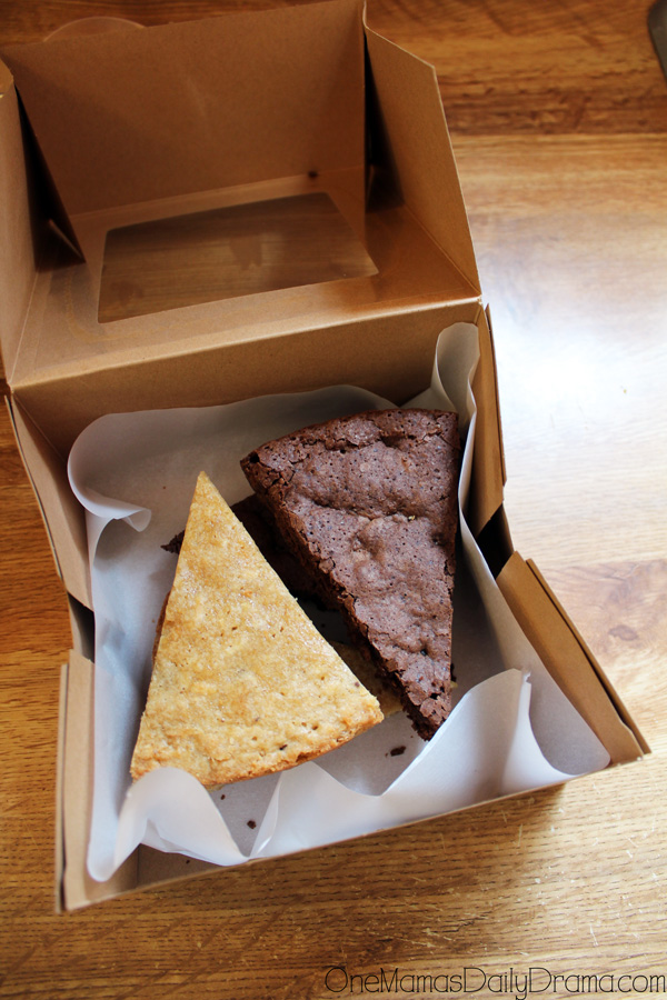Baked goods inside a treat box with parchment paper.