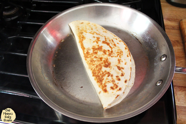 golden brown quesadilla in a skillet