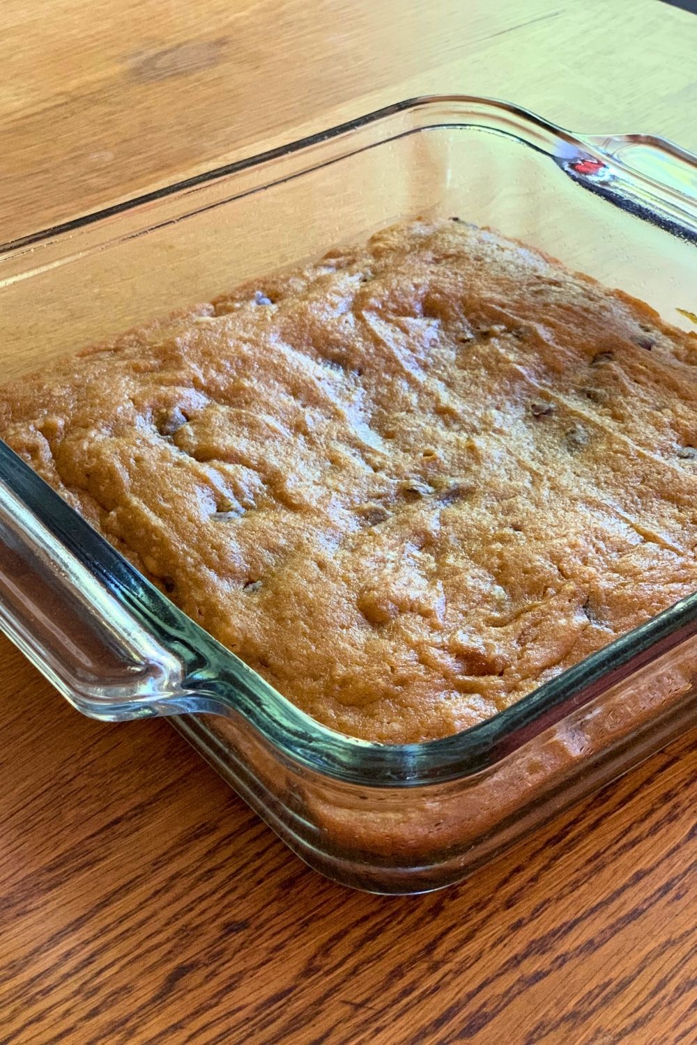 A square glass pan of baked bars.