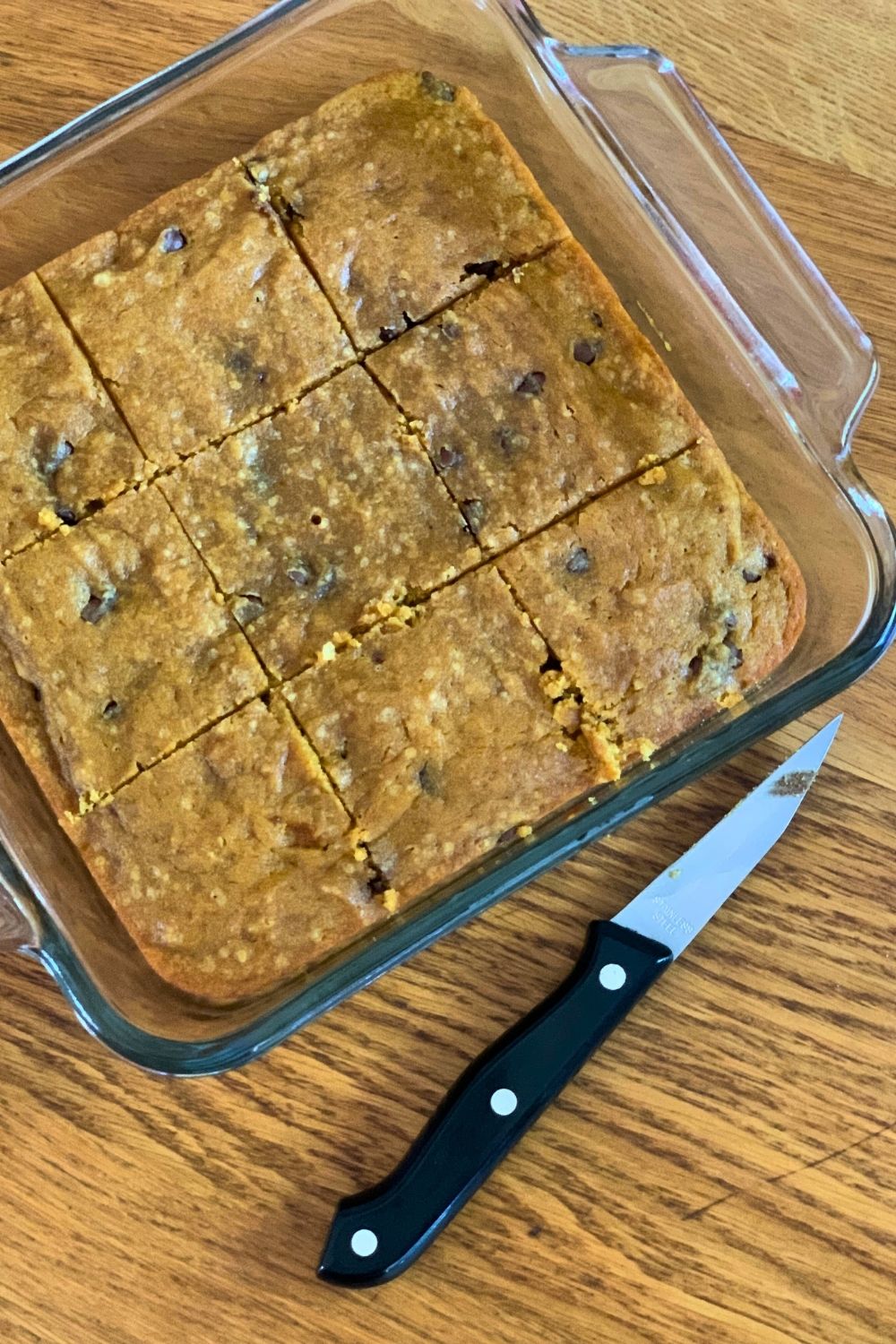 A pan of dessert bars cut into 9 large squares.