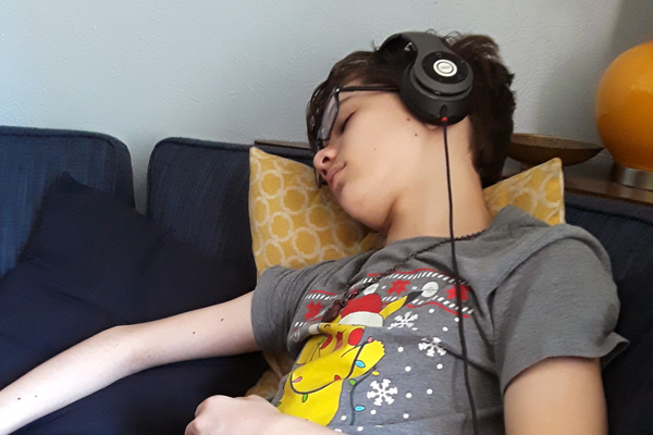 sleeping child wearing iJoy headphones