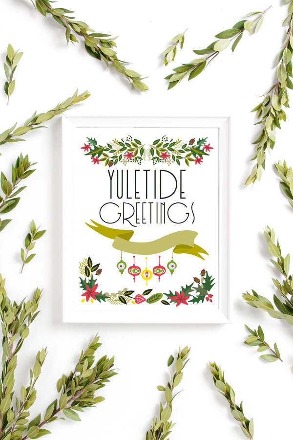 framed print of vintage ornaments and greenery with lettered "Yuletide Greetings"