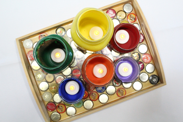 tea light candleholders on a wooden tray