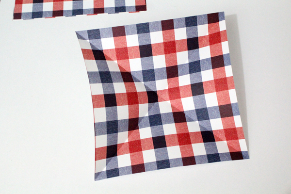 a square paper creased at the corners