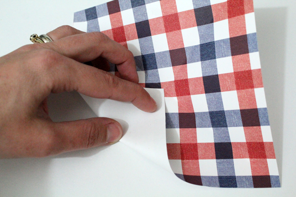hand folding paper from corner to center