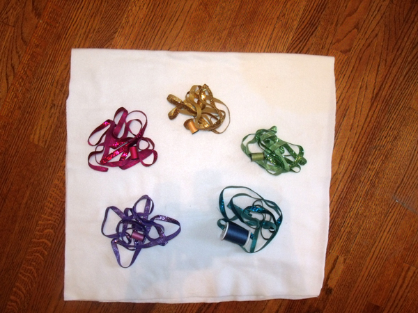 ribbon and matching thread in pink, yellow, lime green, blue, and purple