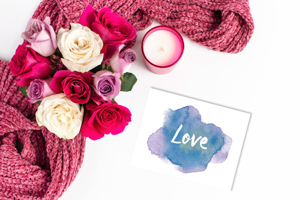 dark blue and purple watercolor card with white text that reads "love"