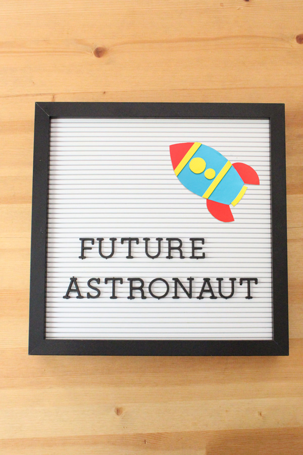 letter board with text "future astronaut" and a paper rocket