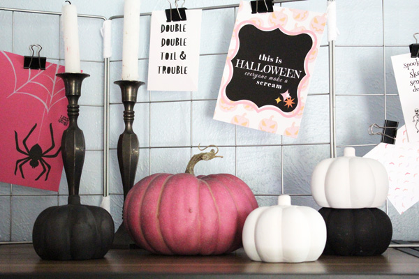 book and movie quote printables behind pink, black, and white pumpkins
