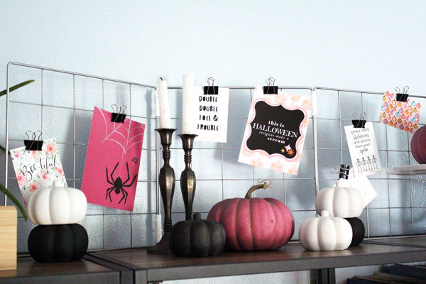 pink, black, white pumpkins and metal candlesticks with Halloween printables