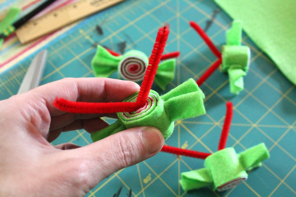pipe cleaner sticking out of the back of a felt candy piece