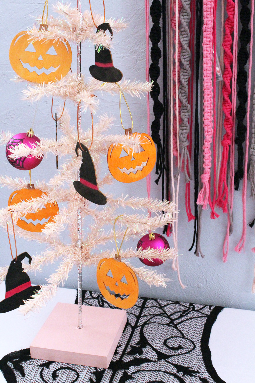 Closeup of wooden ornaments on a Halloween tree.