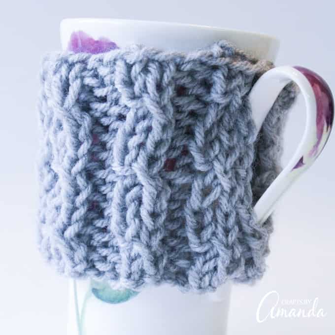 Gray knit mug cozy from Crafts by Amanda.