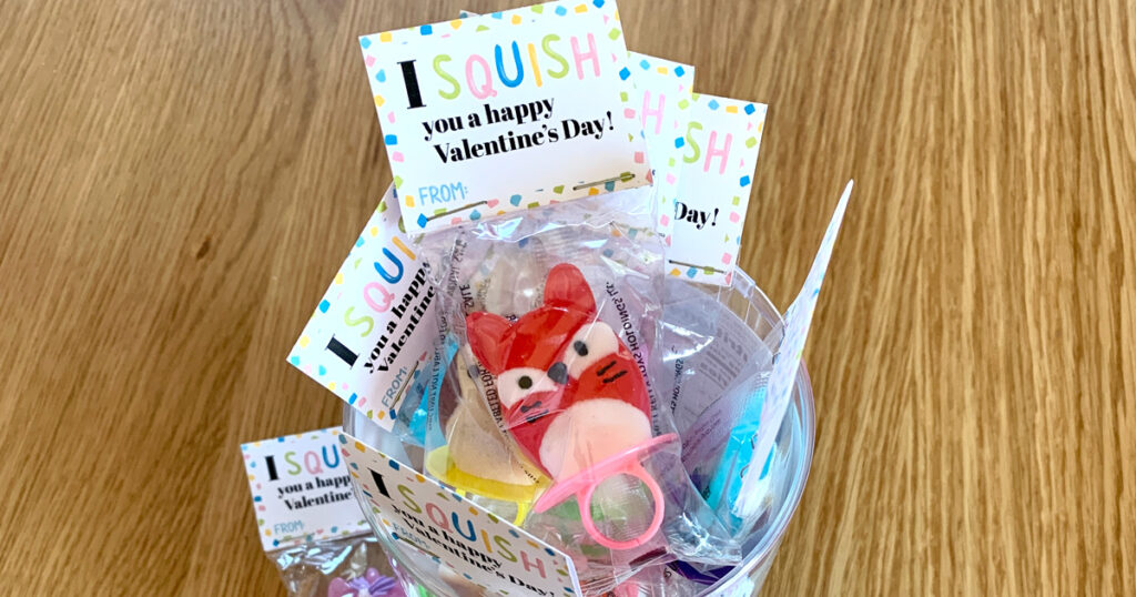 Printable Squishmallow valentine's card attached to ring pop bags.