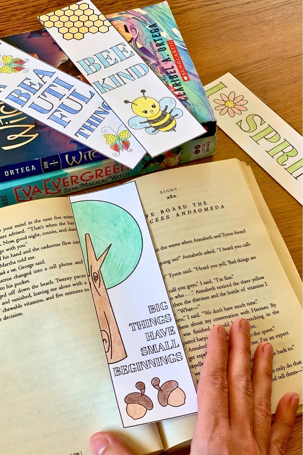 A printed paper bookmark with acorns and a tree with text "big things have small beginnings."
