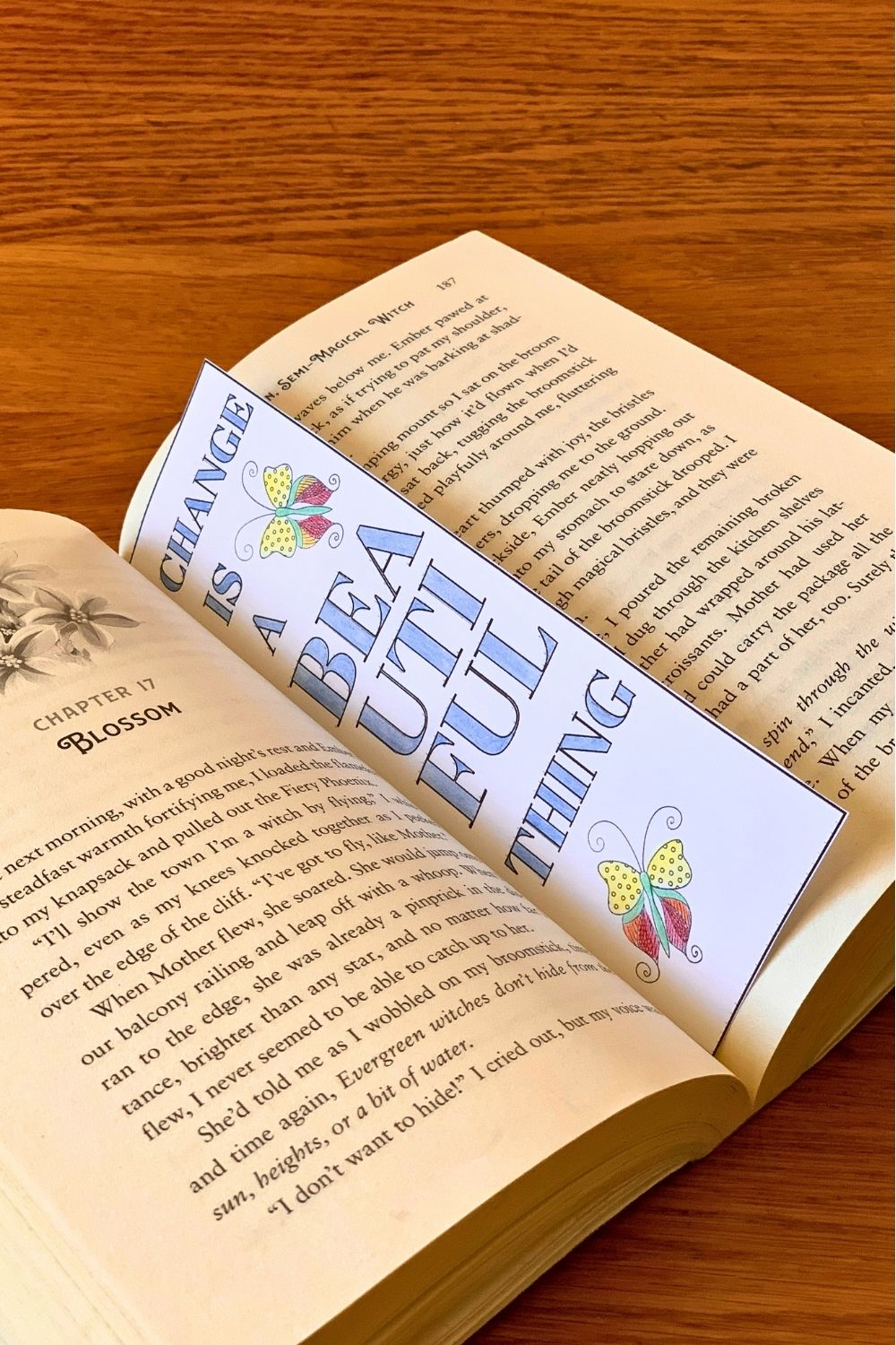 A bookmark with butterfly clipart and the words change is a beautiful thing.