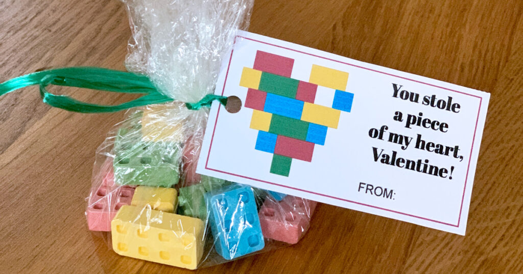 Printable LEGO valentine card attached to a bag of candy blocks.