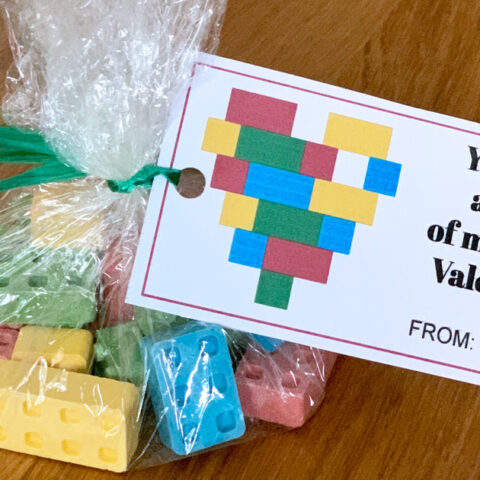 Printable LEGO valentine card attached to a bag of candy blocks.