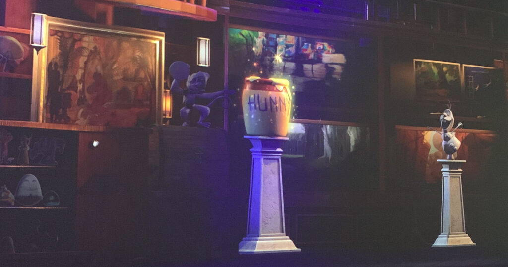 Glowing honey pot on a pedestal in the video vault at Immersive Disney.