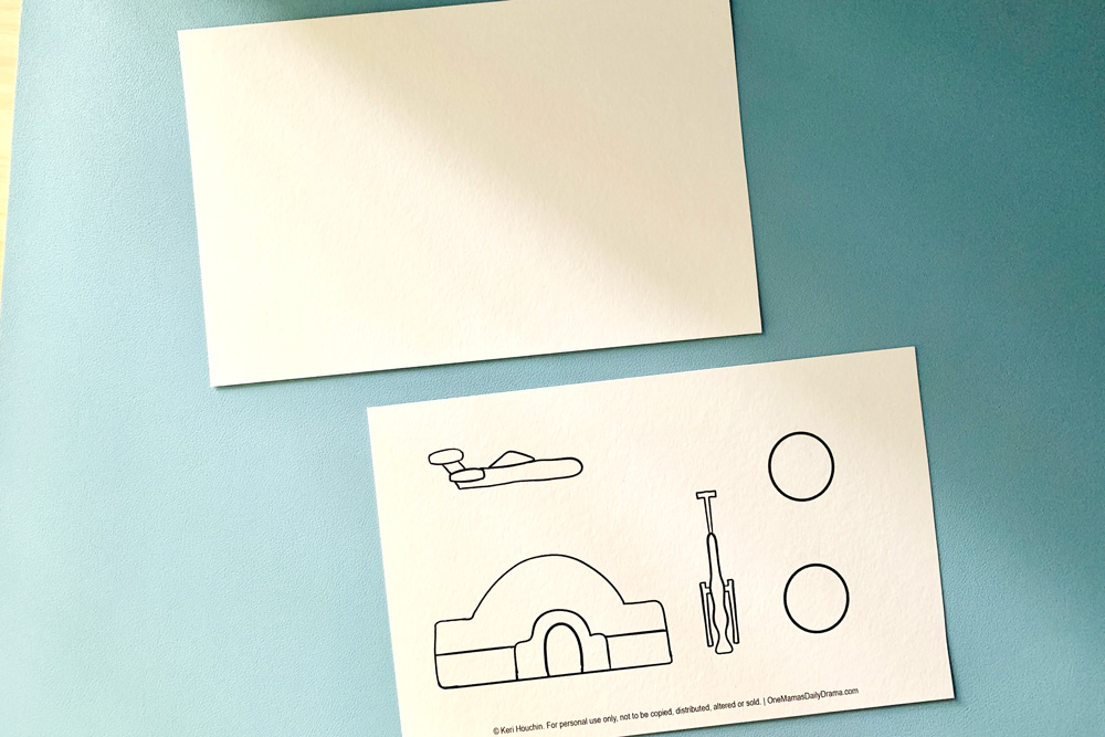 Watercolor paper cut in half with the top blank and the bottom with a speeder, moisture evaporator, house, and two suns.