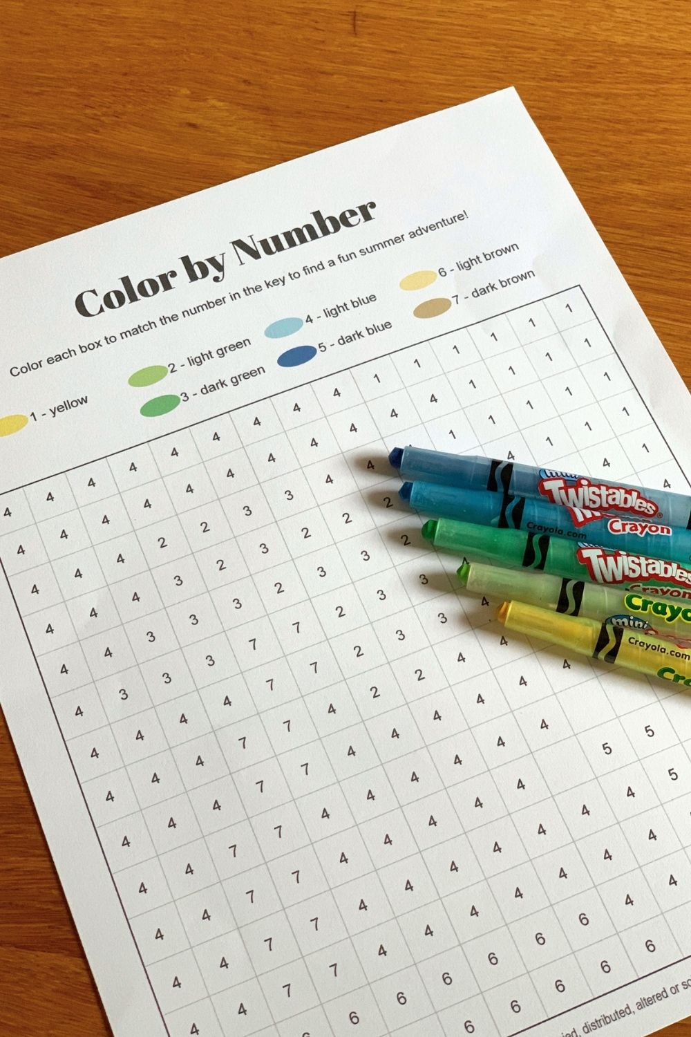 A blank grid coloring page with a number in each box and a key of colors.