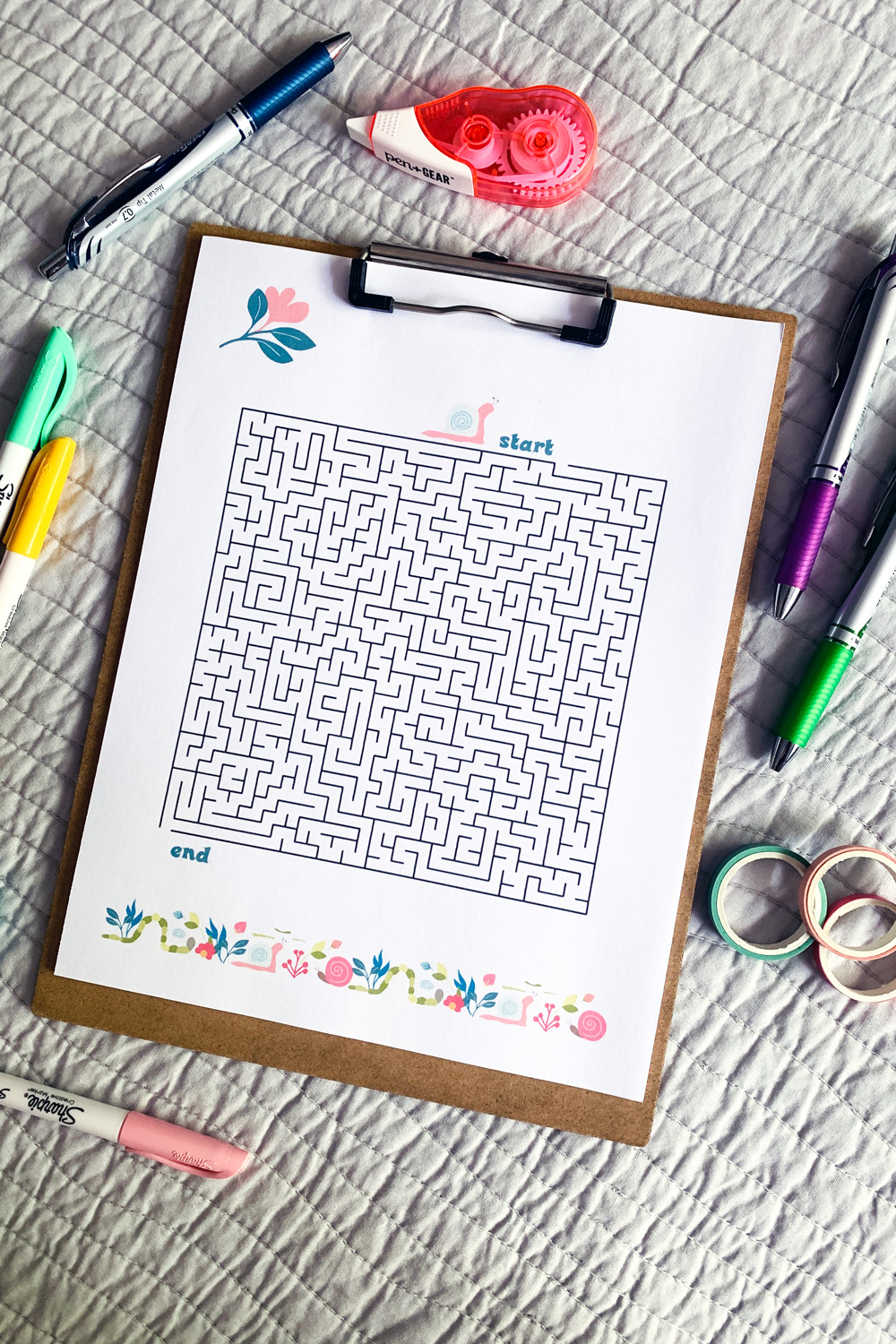Spring maze decorated with pastel snails and flowers.