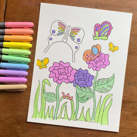 Butterfly coloring page colored with pastel markers in pink, yellow, green, and purple.