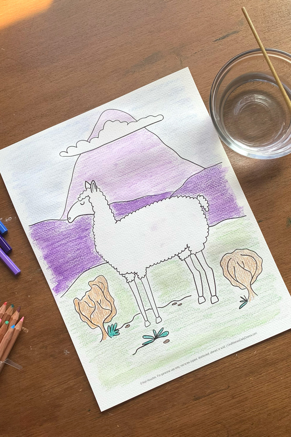 Llama coloring page with a white llama standing in a green field beside shrubs against a purple mountain background.