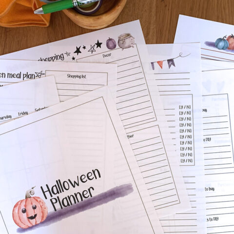 Printed Halloween planner with purple and orange clipart and lined pages.