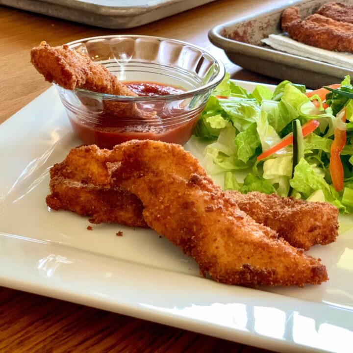Crispy breaded chicken parmesan bites with marinara sauce.