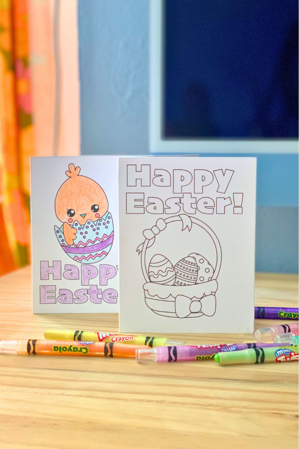 A pair of Easter coloring cards, one with a chick hatching from an egg and the other a basket of decorated eggs.