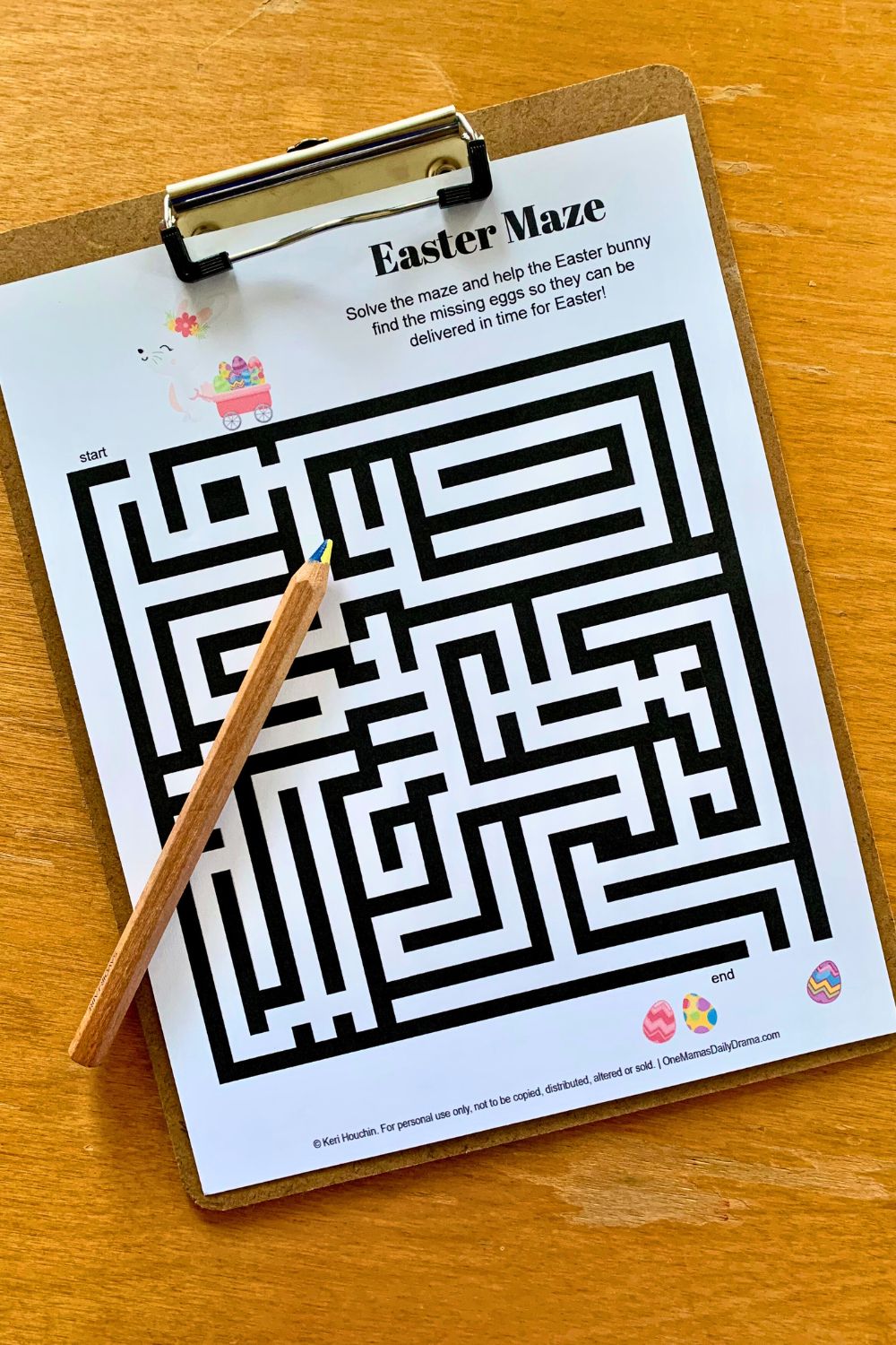 Printable Easter maze of a bunny pulling a wagon searching for painted eggs.