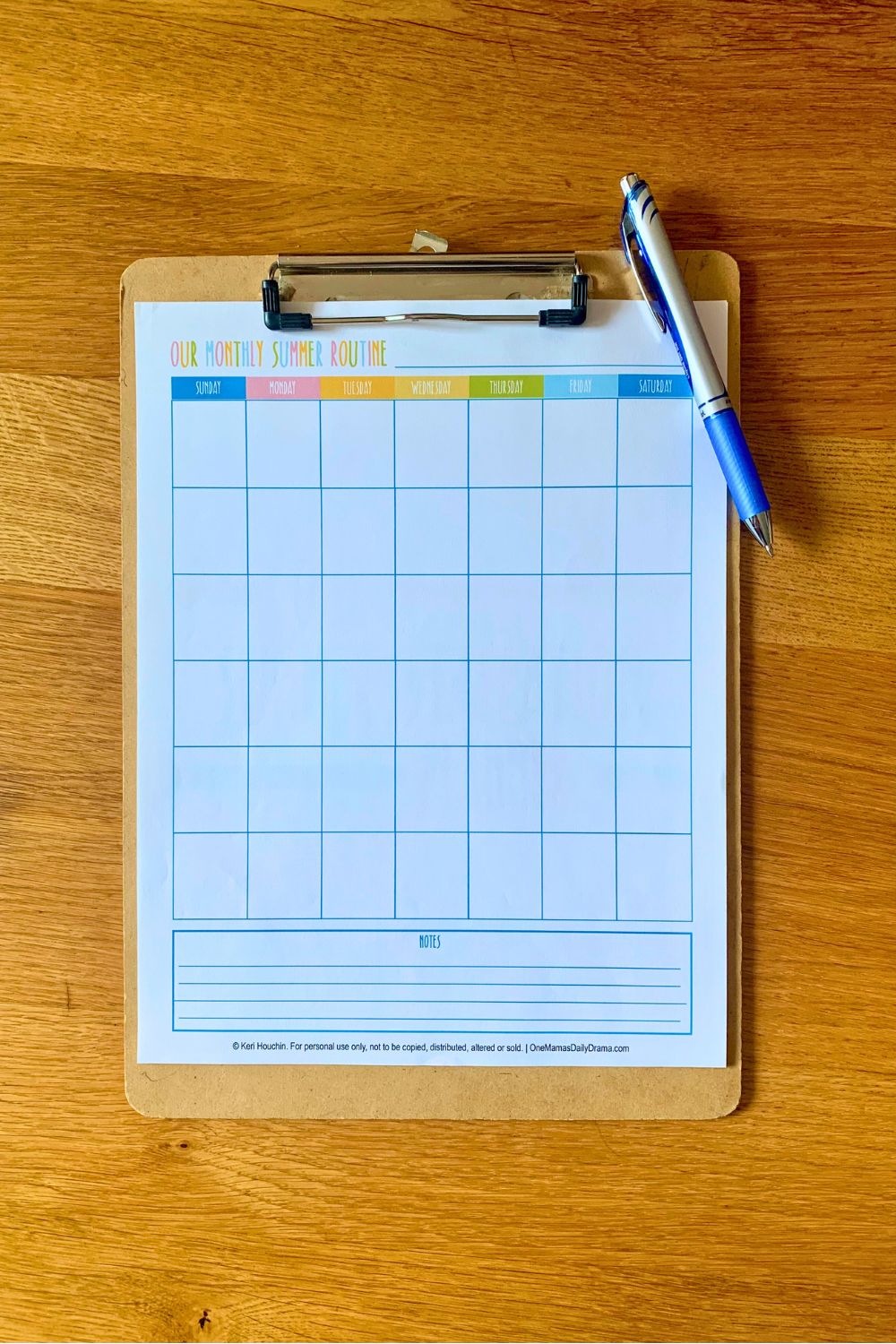 A printed calendar page with 6 weeks of undated boxes and colorful day headings.