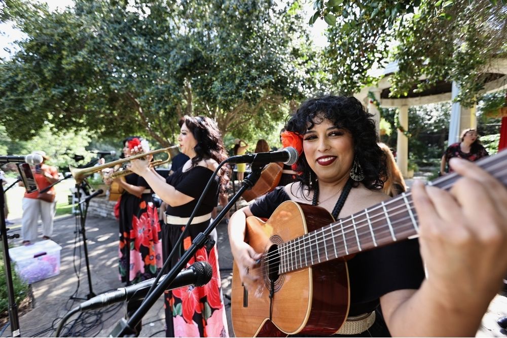 A musical group performs at Celebramos at the Fort Worth Botanic Garden.