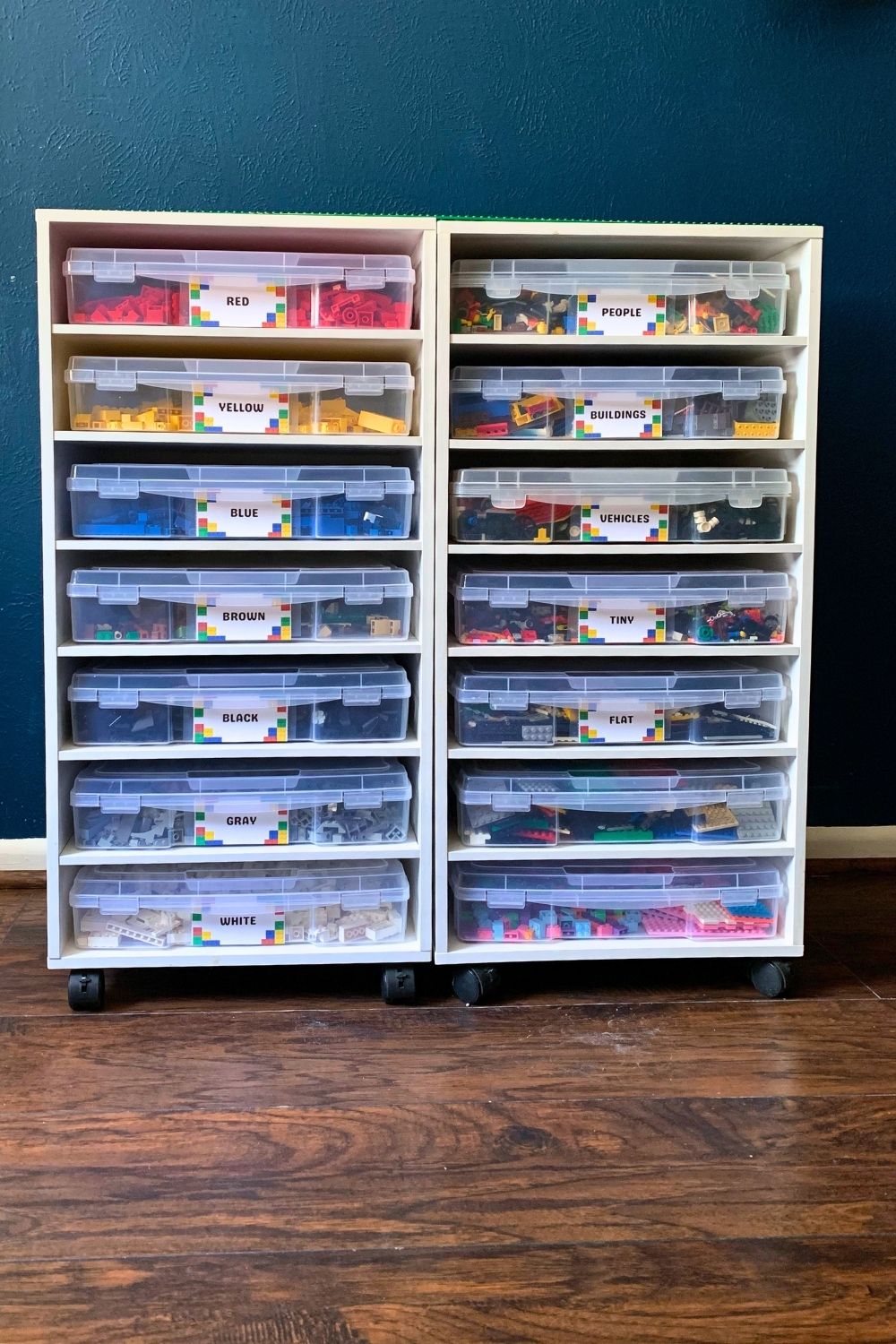 LEGO storage with labels on clear plastic drawers in a rolling cart.