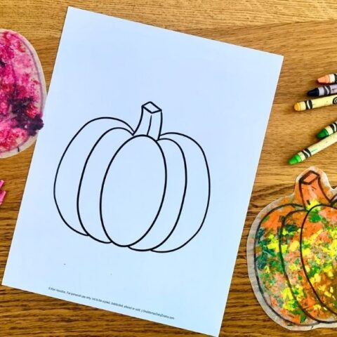 Melted crayon pumpkin craft made by melting crayon shavings between wax paper.