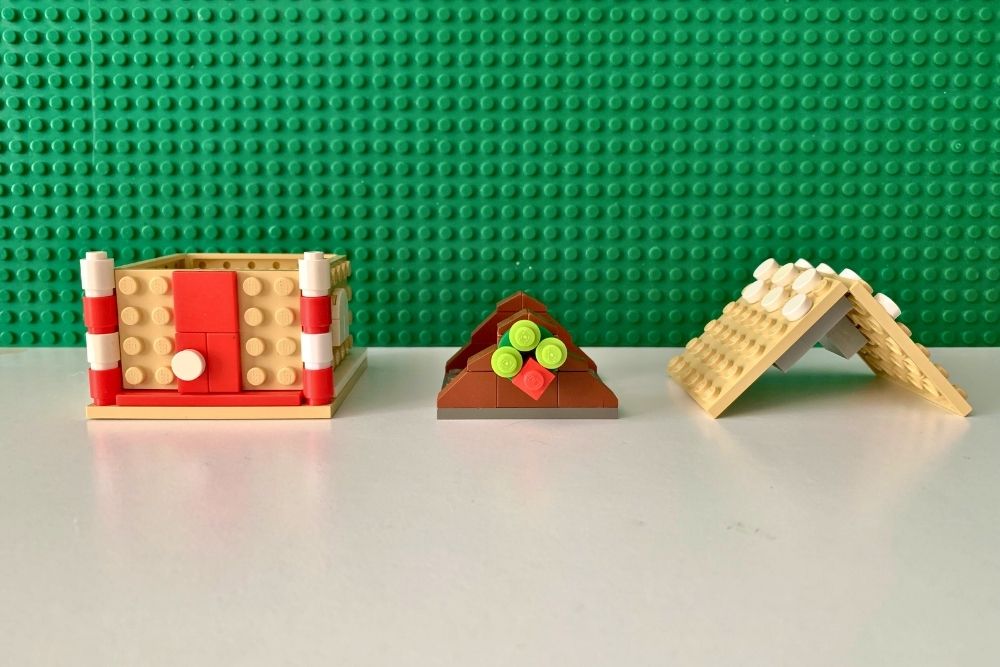 LEGO gingerbread house in 3 sections: the square walls, triangle roof support, and V-shaped roof.