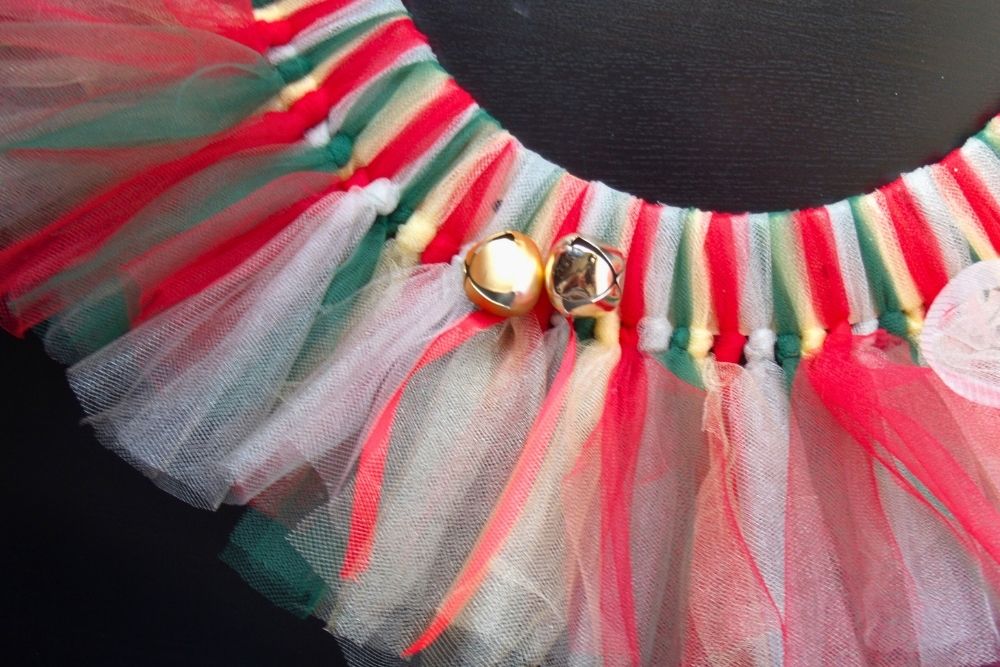 Bells on ribbon tied to the wreath.