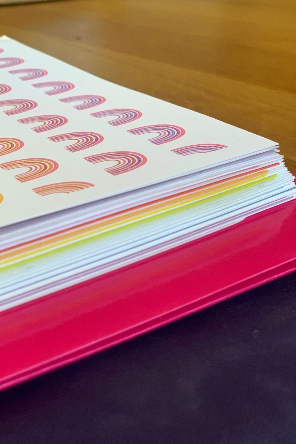 Stacked pages showing colorful washi tape along several of the edges.